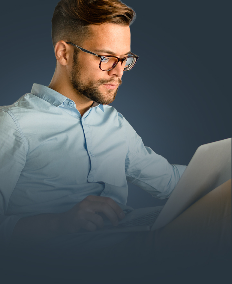 A treasury practitioner reviewing data at his laptop