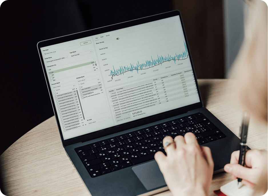 A fund treasury user reviewing cash data on a laptop